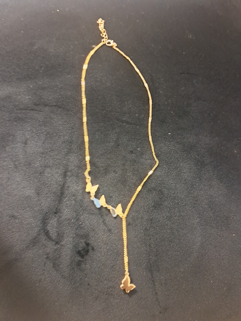 Gold Butterfly Lariat Necklace with Blue Accents